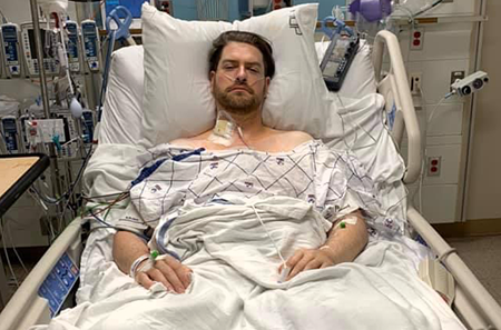 Tim Jones in hospital bed